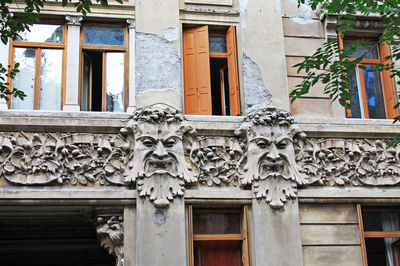 Close-up of statue against building