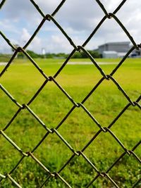 Full frame shot of chainlink fence on field