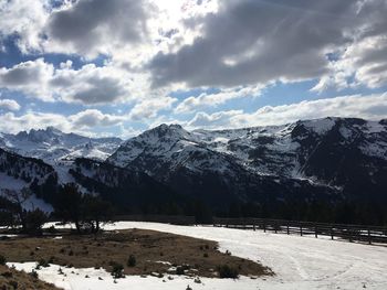 Scenic view of snowcapped mountains against sky