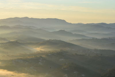 Scenic view of mountains against sky during sunset