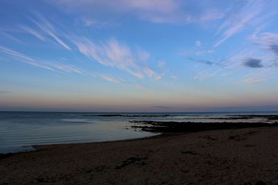 Scenic view of sea against sky at sunset