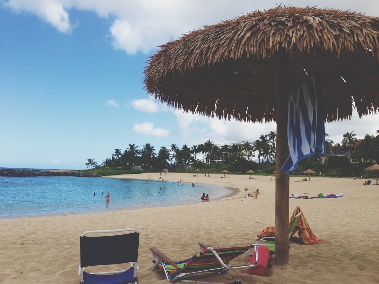 beach, sea, water, sand, shore, sky, vacations, beach umbrella, lounge chair, horizon over water, tree, parasol, relaxation, scenics, tranquil scene, tranquility, palm tree, nature, thatched roof