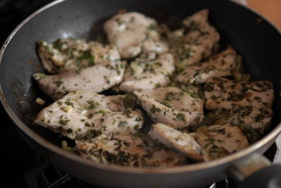 High angle view of meat in cooking pan