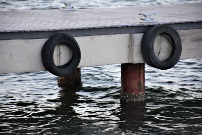 Close-up of pier in sea
