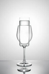 Two glasses of different shapes on a white background.