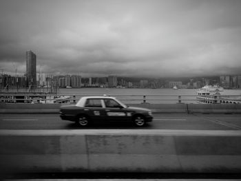 City street against cloudy sky