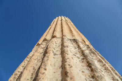 Low angle view of historical building against blue sky