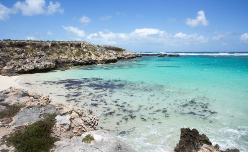 View of beach against cloudy sky