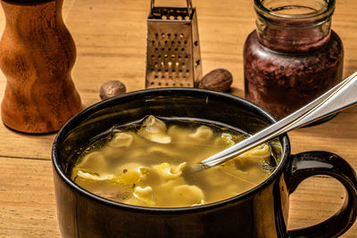 High angle view of capeletti soup served in bowl