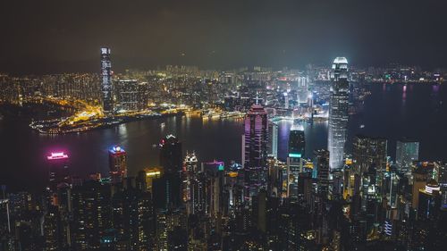 High angle view of buildings in city at night