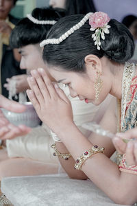 Midsection of woman with arms raised