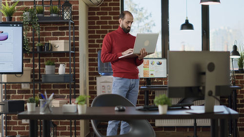 Businessman using laptop at office