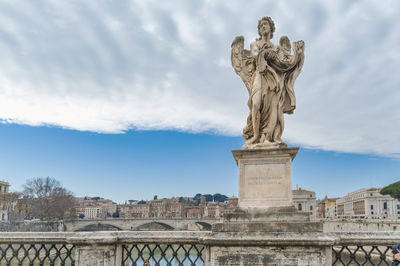 Low angle view of statue against sky