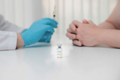 Close-up of woman hand holding bottle