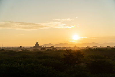 Scenic view of landscape against sky during sunset