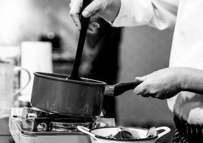 Midsection of man preparing food