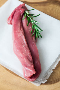 High angle view of meat on cutting board