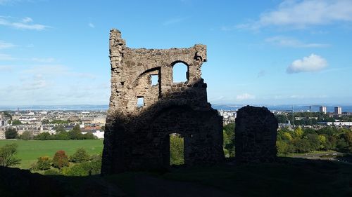 Old ruin building against cloudy sky