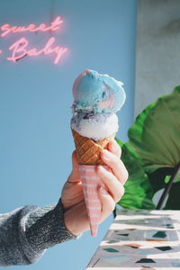 Person holding ice cream cone