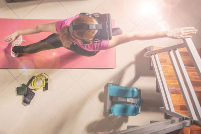 High angle view of woman using mobile phone at home