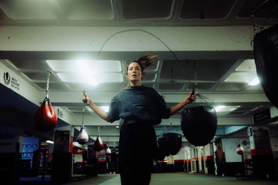 Side view of man standing at airport