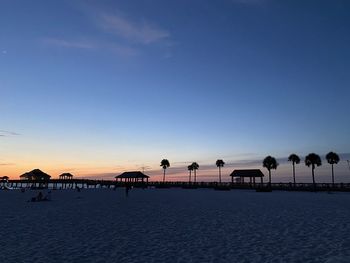 Scenic view of beach against sky during sunset