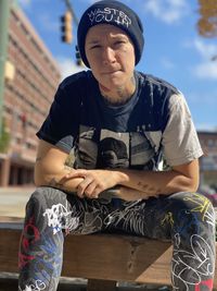 Portrait of young man sitting outdoors