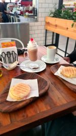 High angle view of breakfast served on table at cafe