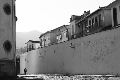 Woman standing against wall