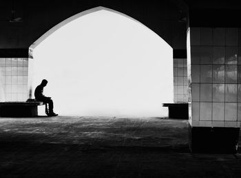 Side view of silhouette man sitting