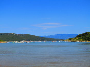 Scenic view of sea against blue sky