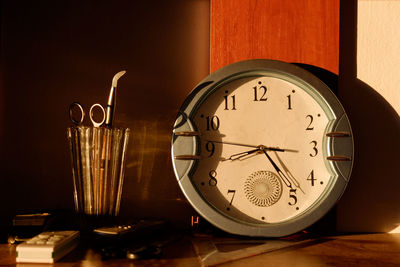 Close-up of clock on table