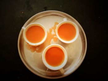 High angle view of tea cup against black background