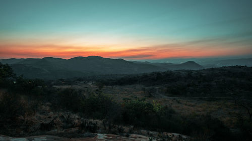 Scenic view of mountains against sky during sunset