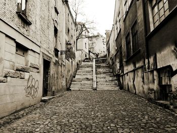 Walkway amidst buildings