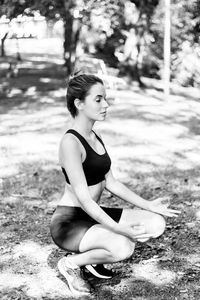 Young woman sitting on land