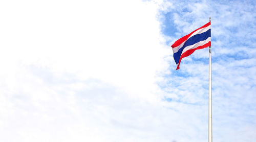 Low angle view of flag against sky