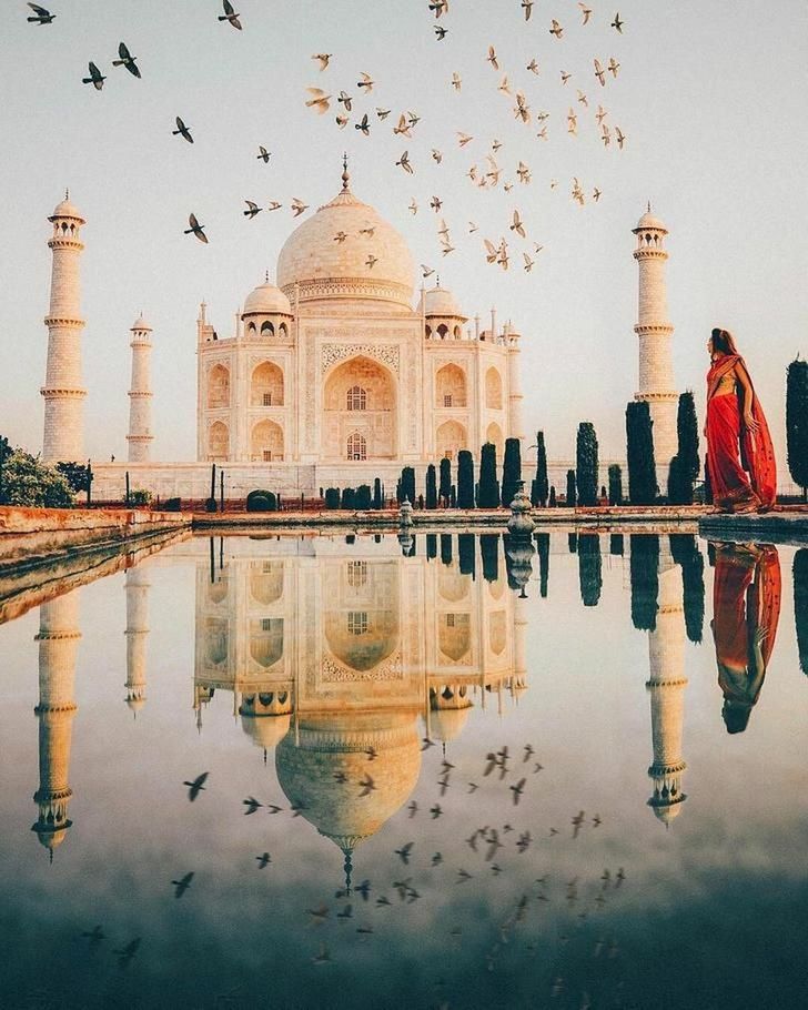 REFLECTION OF BUILDING IN LAKE