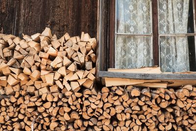 Heap of firewood by window