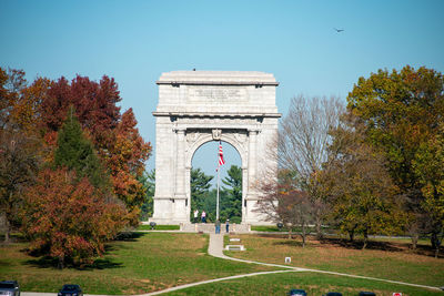 The national memorial arch at valley forge national historical park with turkey vultures flying arou