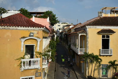 Houses in town against sky
