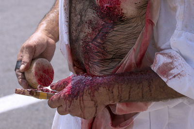 Close-up of man working on cutting board