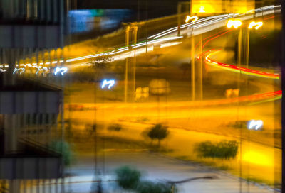 Light trails on road in city at night