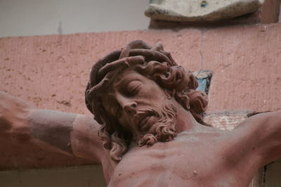 Close-up of statue against water