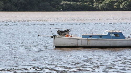 Boat moored on river