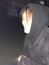 Portrait of beautiful young woman with light painting at night