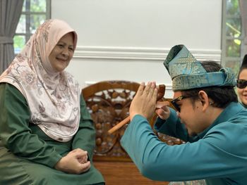 Cheerful family celebrating eid at home