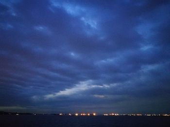 Scenic view of sea against sky at night