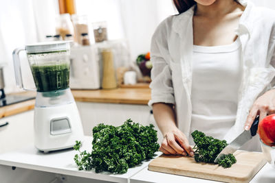 Midsection of woman preparing food