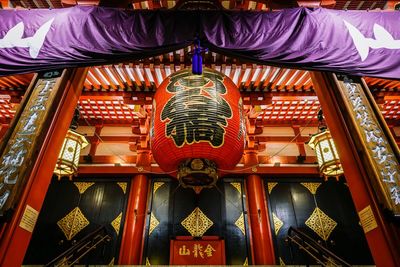 Low angle view of lantern hanging in building